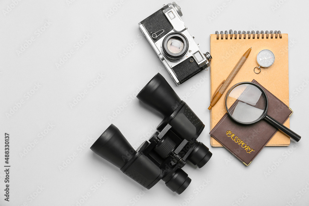 Set of travel items with passport and notebook on white background Set of travel items with passport and notebook on white background
