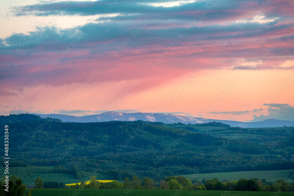 view on Karkonosze mountains from Kaczawskie mountains during spring sunset, Poland