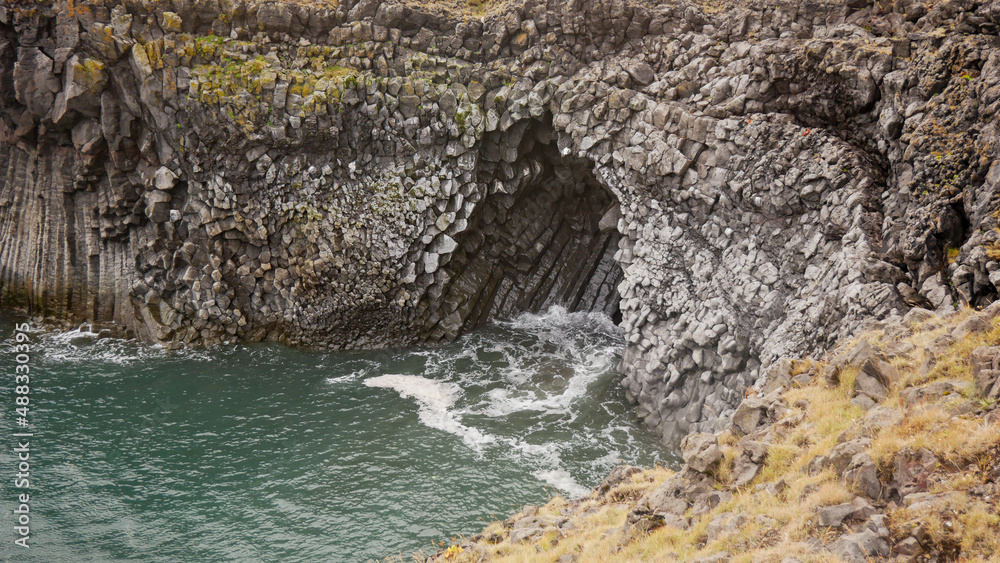 basaltic cave on a black beach in iceland