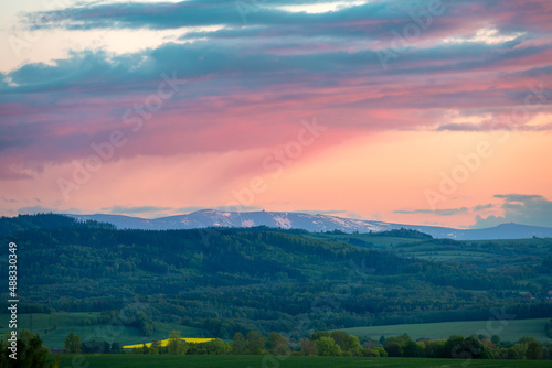 Obraz na płótnie view on Karkonosze mountains from Kaczawskie mountains during spring sunset, Poland w salonie