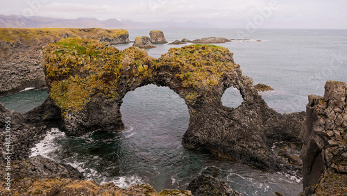 stone arch on the atlantic ocean in iceland © sanbeliaev