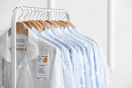 Rack with clean shirts in p...