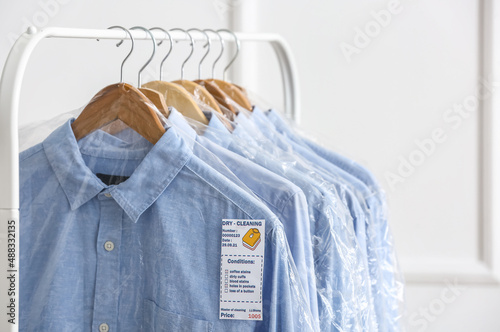 Rack with clean shirts in p...