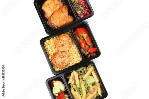 Containers with tasty food on white background