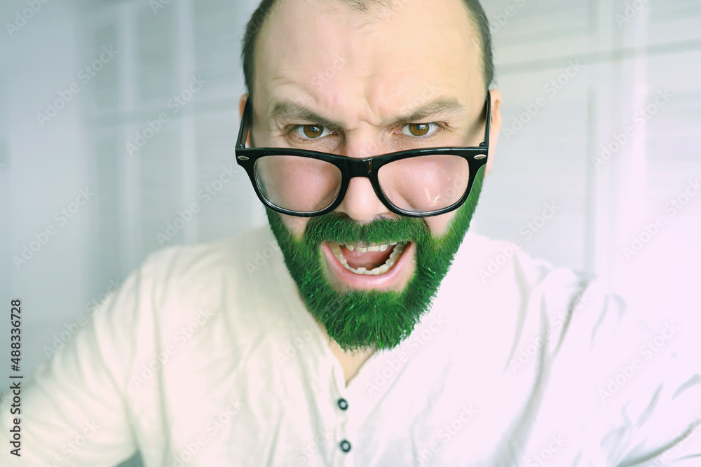 Happy saint patricks day. A man with a green beard. St.Patrick 's Day. Irish fan color beard.