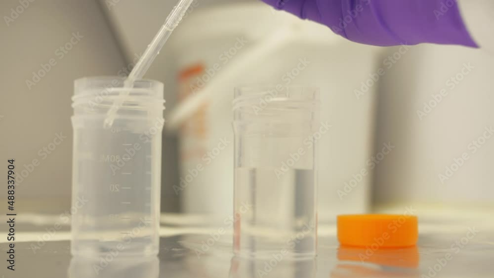 handling pipette to transfer liquid in laboratory slow motion 4k handling pipette to transfer liquid in laboratory slow motion 4k