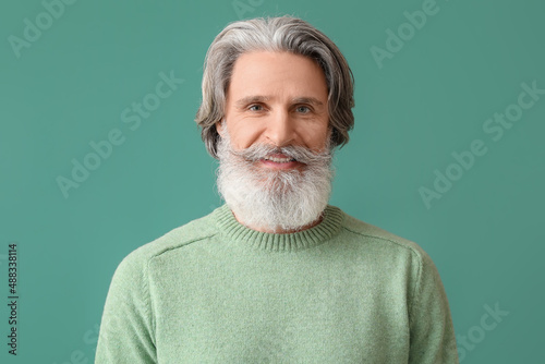 Handsome senior man in knit...