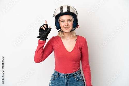 Young caucasian woman with a motorcycle helmet isolated on white background pointing up a great idea