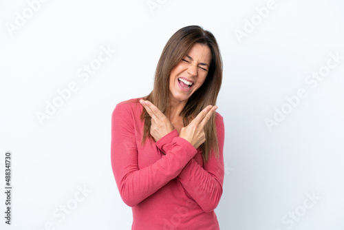 Middle age caucasian woman isolated on white background smiling and showing victory sign