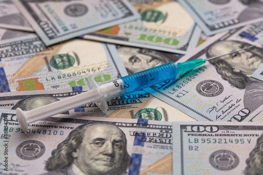Syringe on 100 dollar banknote Syringe on 100 dollar banknote