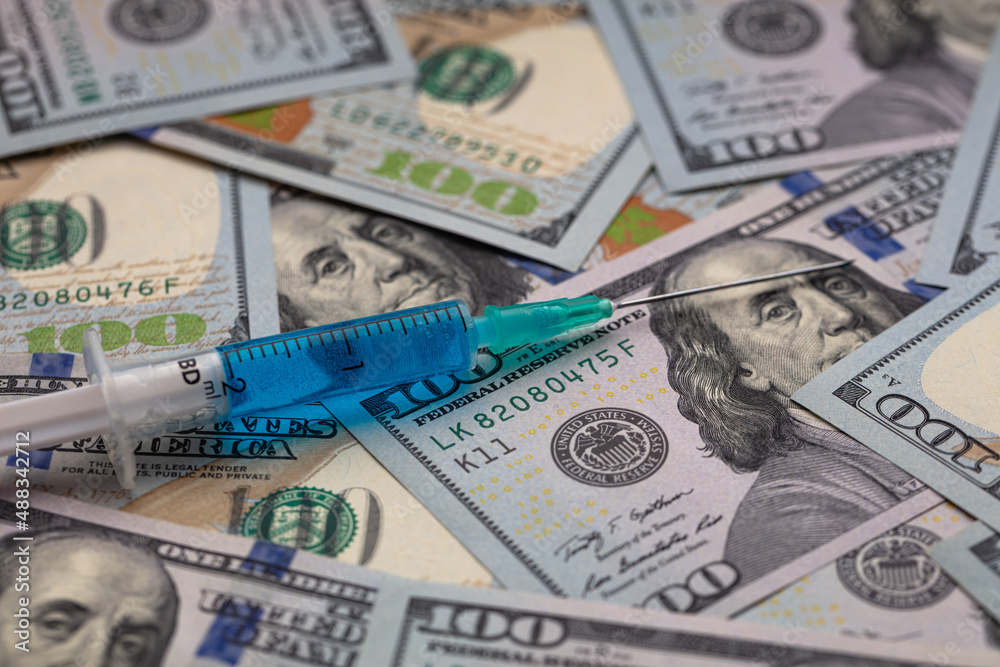 Syringe on 100 dollar banknote Syringe on 100 dollar banknote