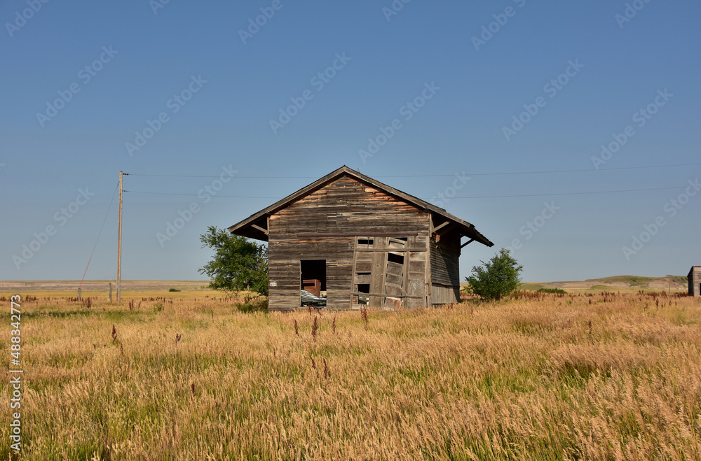 Fototapeta premium Deserted Weathered Wooden Building in a Ghost Town
