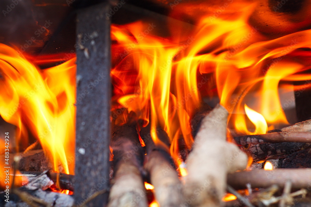 Colorful fire prepared to cook rice with ribs to share with friends in good company Colorful fire prepared to cook rice with ribs to share with friends in good company