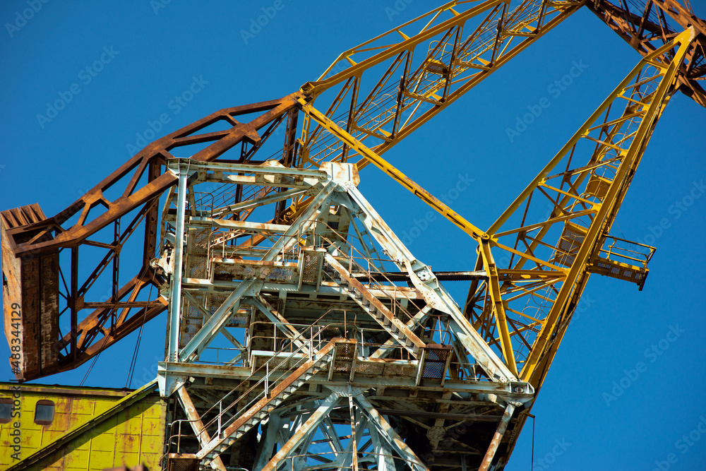Shipbuilding crane against the blue sky, close-up Shipbuilding crane against the blue sky, close-up
