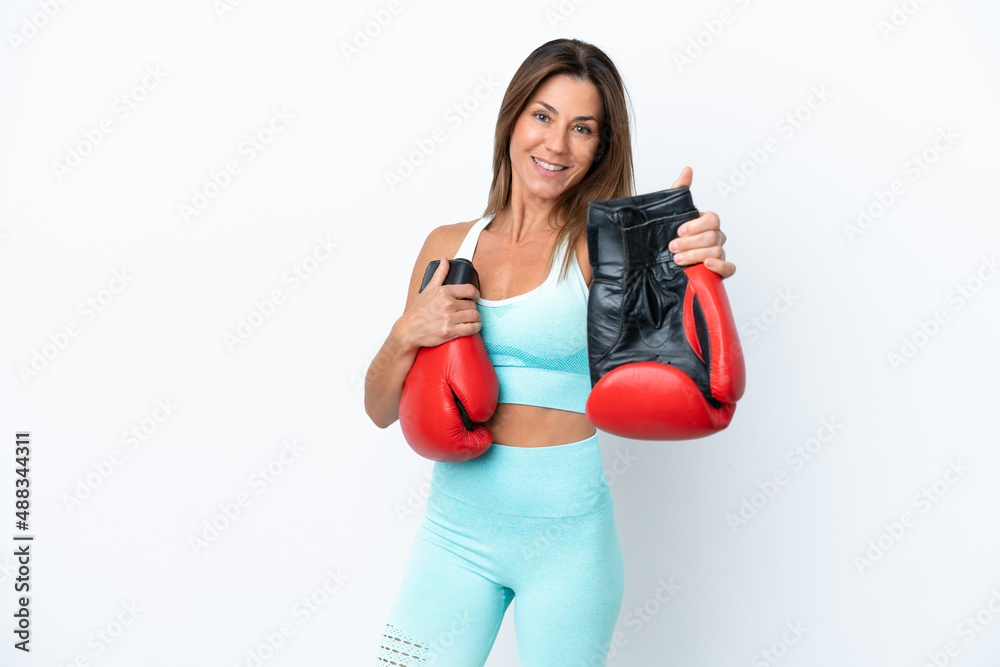 Middle age caucasian woman isolated on white background with boxing gloves