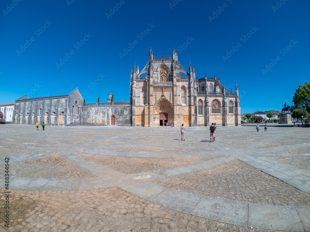 Obraz premium Batalha, Portugal, August 21, 2021: The Monastery of Santa Maria da Vitória. The Monastery of Batalha is one of the most fascinating Gothic monuments of the Iberian Peninsula.