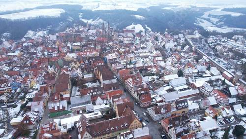 Aerial View: Rooftops with snow in Rothenburg ob der Tauber, Bavaria. Rothenburg is one of the famous tourist attractions in Germany. It’s well known for its well-preserved medieval old town.