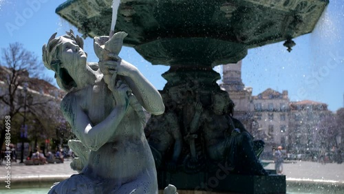 water fountain in Rossio square dowtown Lisbon Portugal slow motion 4k photo