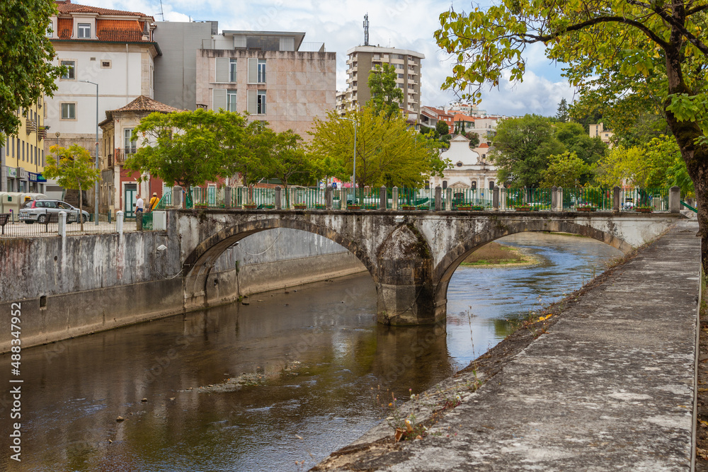 Leiria, Portugal, August 29, 2021: View of Lis River in the city of Leiria, Portugal. Leiria is a city and a municipality in the Center Region of Portugal. Bridge over River Lis and Polis Via.