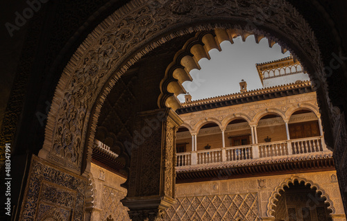 Seville, Spain, September 12, 2021: Royal Palace of Seville (Real Alcazar). The Maidens Courtyard. The Mudejar of Pedro I on the ground floor and the Renaissance of the first monarchs.