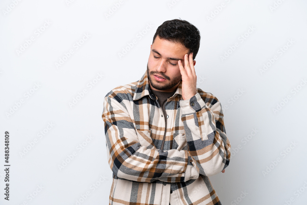 Young Brazilian man isolated on white background with headache Young Brazilian man isolated on white background with headache
