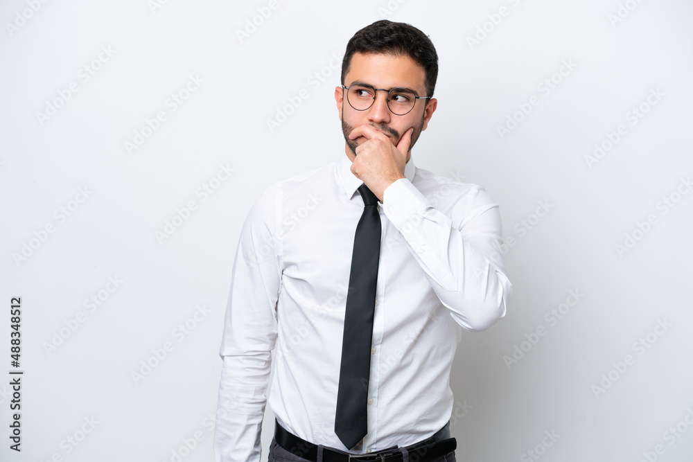Business Brazilian man isolated on white background having doubts and with confuse face expression Business Brazilian man isolated on white background having doubts and with confuse face expression