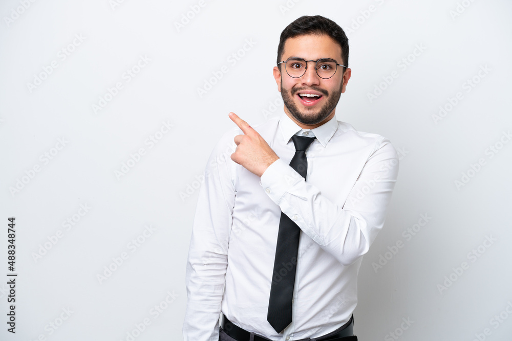 Business Brazilian man isolated on white background surprised and pointing side