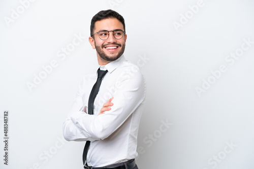 Business Brazilian man isolated on white background with arms crossed and happy