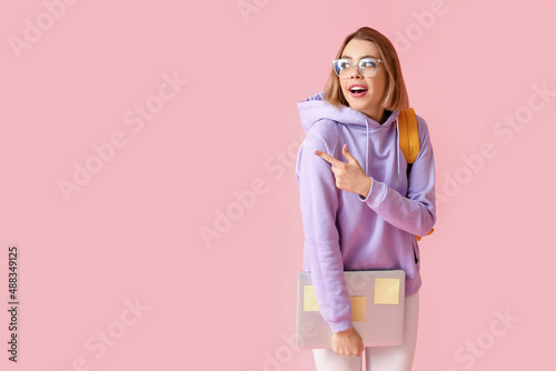 Female student with laptop ...