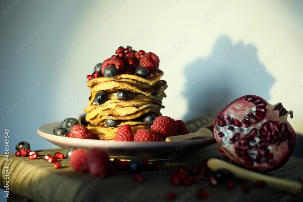 Pancakes. still life. fruit. grenade. blueberries raspberries