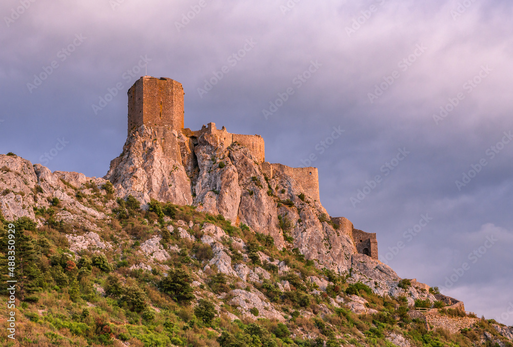 A famous landmark Queribus Castle ruins in south of France Pyrenees Mountains sunset view