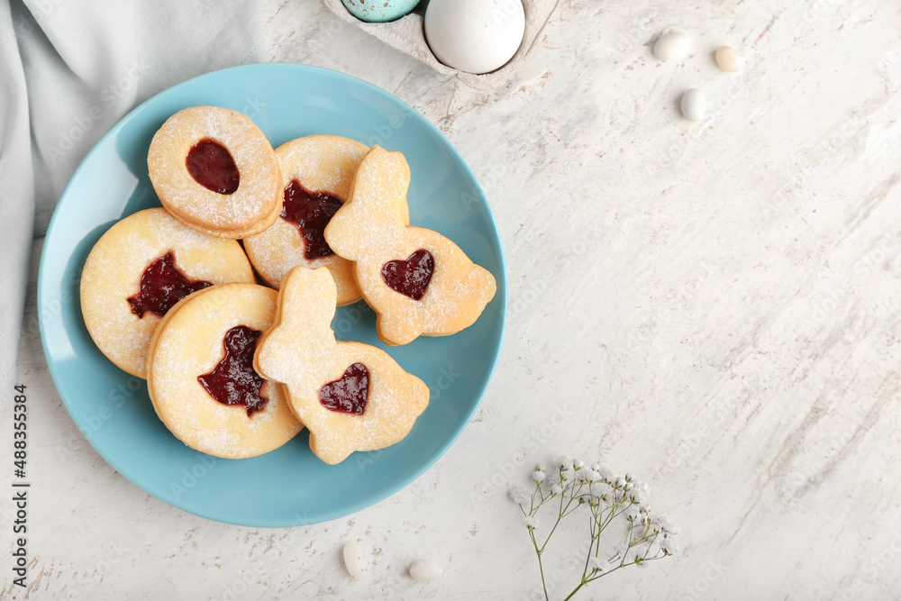 Plate of tasty Easter cookies on light background Plate of tasty Easter cookies on light background