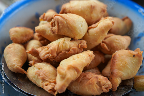 Pisang molen is a light dish made from bananas which is coated with rolls of pastry dough and then fried in oil. photo