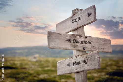 Fényképezés soul balanced healing text quote on wooden signpost outdoors in nature during sunset