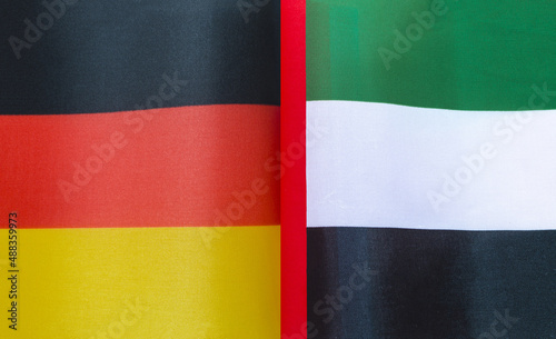 fragments of the national flags of Germany and the United Arab Emirates in close-up