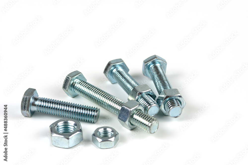 close up bolts and nuts isolated on white close up bolts and nuts isolated on white