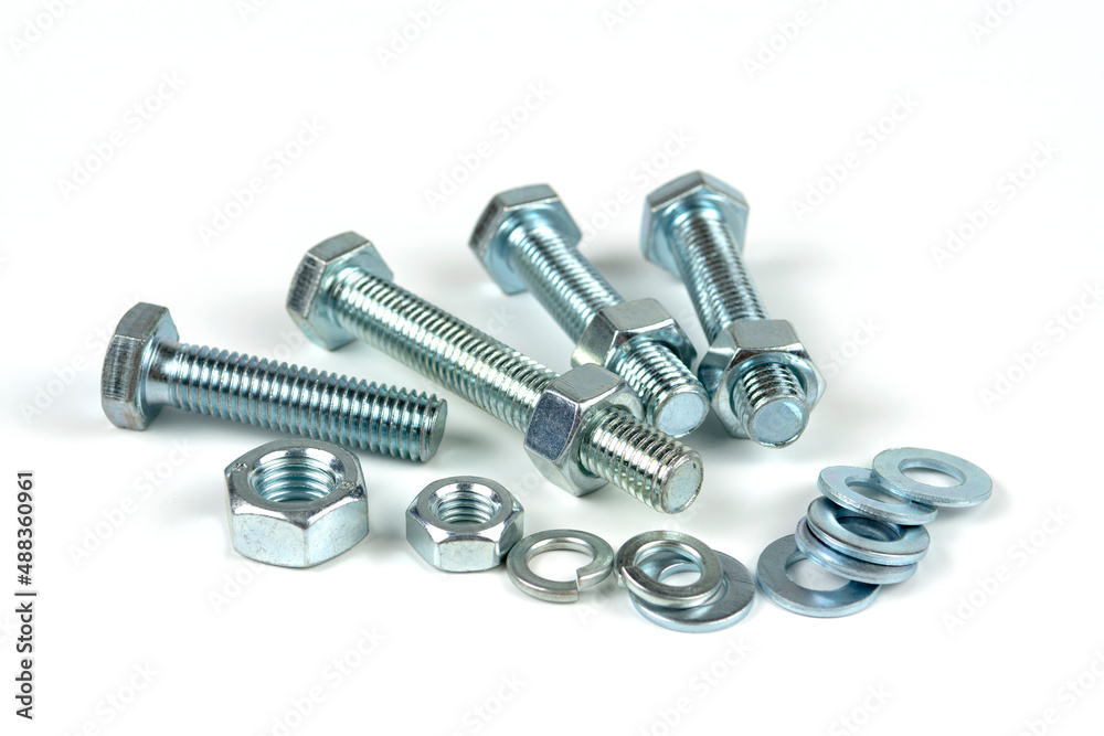 metal bolts and nuts with round washers close-up on a white background metal bolts and nuts with round washers close-up on a white background