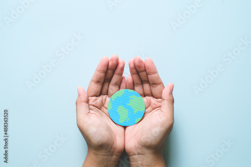 Hands holding earth, save planet, earth day concepts