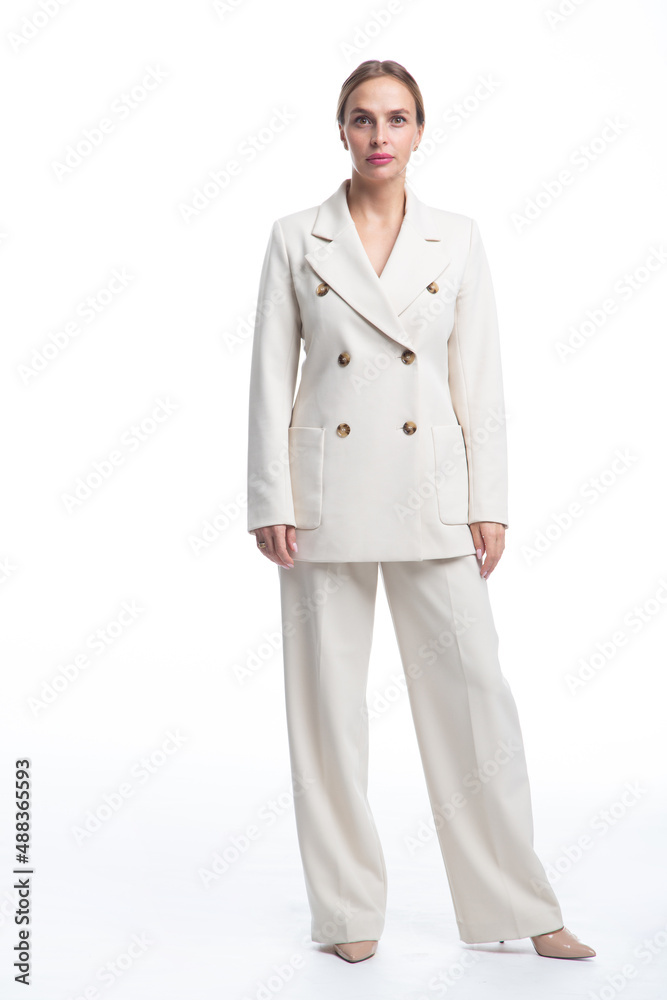Photo of beauty female worker businesswoman dressed in formal wear looking at camera while working and sitting at desk in office isolated over white background Photo of beauty female worker businesswoman dressed in formal wear looking at camera while working and sitting at desk in office isolated over white background