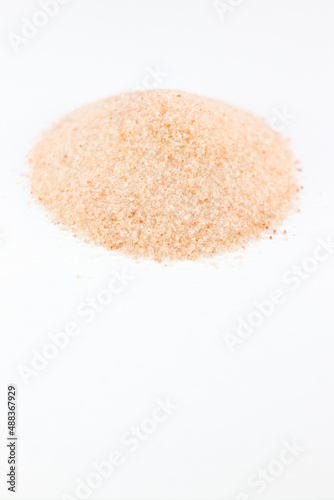 One Heap Of Himalayan Pink Salt Closeup on White Background