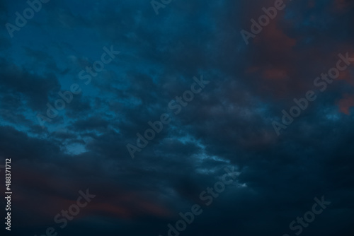 Dark cloudy sky evening, blue of colour. Natural landscape.