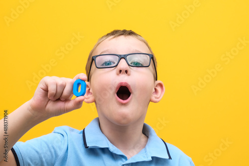 speech therapy, the boy learns to pronounce sounds and words correctly