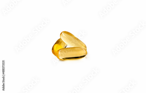 Vitamin capsules on a white background. Dietary supplements: fish oil, omega-3, omega-6, omega-9, vitamin A, E, vitamin D, vitamin D3, evening primrose oil, borage.