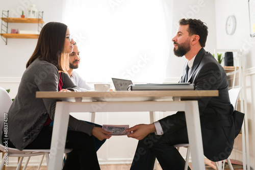 Couple giving hush money to financial agent