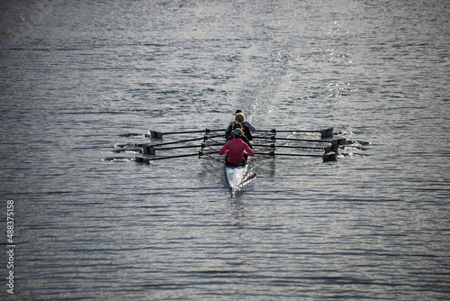 Portrait on back view of women  rowing in the river in kayak