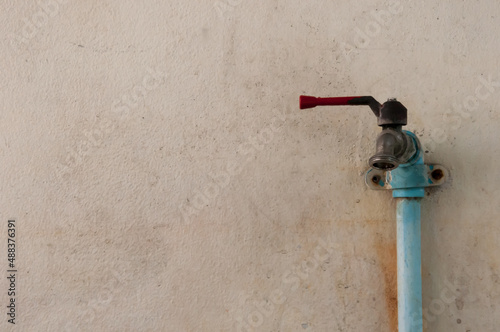 old water valve on the wall 