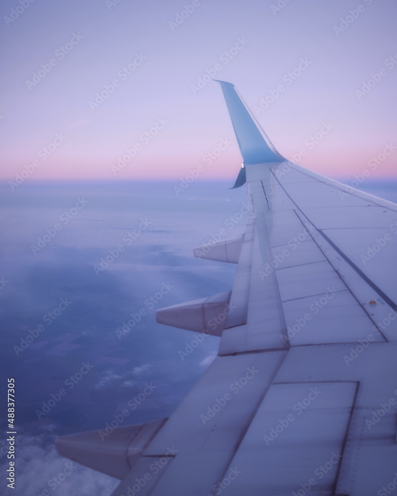 View from the window of the plane on the wing in the morning