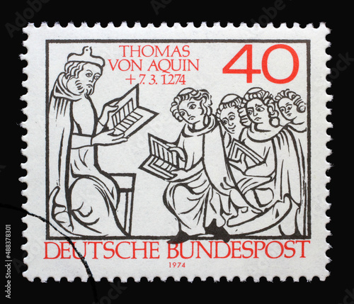 A stamp printed in Germany shows Thomas Aquinas Teaching, 700th Death Anniversary of Thomas Aquinas, scholastic philosopher, circa 1974