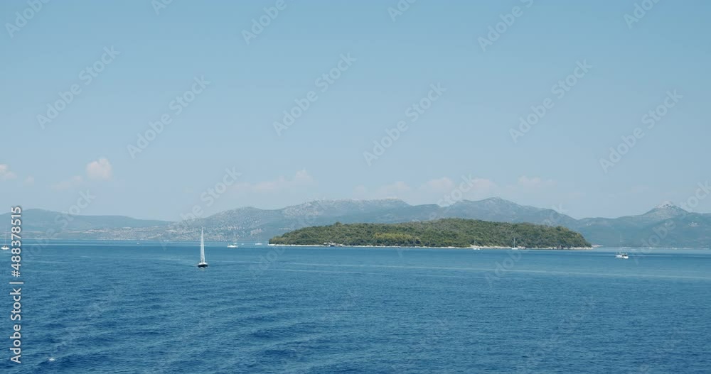 Catamaran yacht boat sailing in open ionian sea. Luxury summer travel concept Catamaran yacht boat sailing in open ionian sea. Luxury summer travel concept