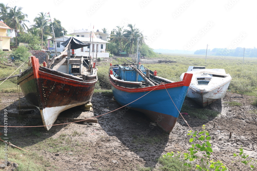 Wooden boats parked at dry land after fishing in India